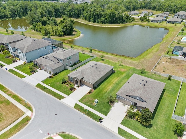 aerial view of residential area with a large body of water