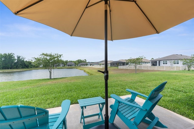 view of patio with a water view
