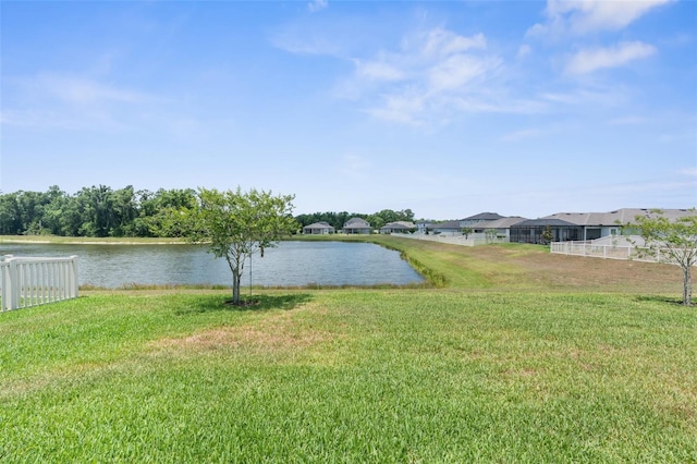 water view featuring nearby suburban area and fence