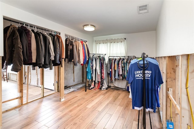 spacious closet with visible vents and wood finished floors