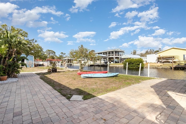 exterior space featuring a boat dock and a water view