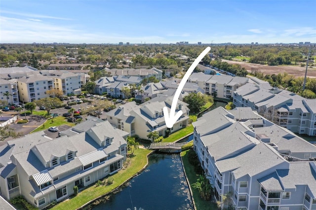 birds eye view of property featuring a residential view and a water view