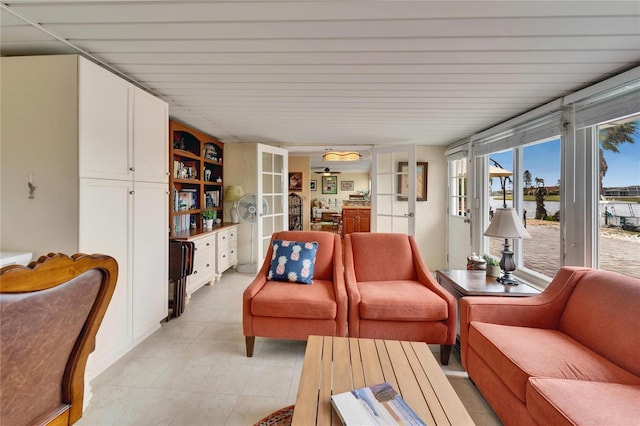 living room with light tile patterned floors and french doors