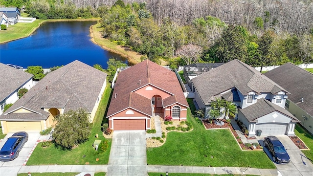 birds eye view of property with a residential view and a water view