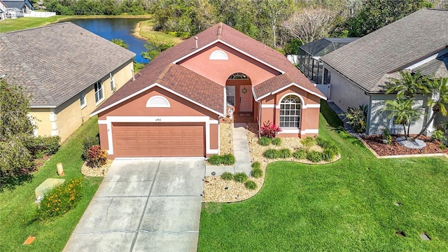 view of front of home with a front lawn, roof with shingles, stucco siding, a garage, and driveway