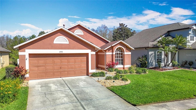 ranch-style home featuring stucco siding, an attached garage, concrete driveway, and a front lawn