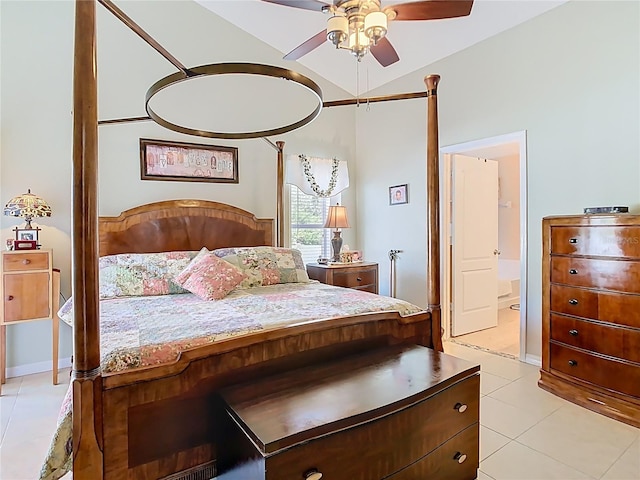 unfurnished bedroom with light tile patterned flooring, ensuite bath, ceiling fan, and vaulted ceiling