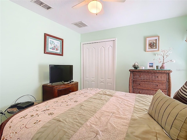 bedroom featuring visible vents, a closet, and ceiling fan