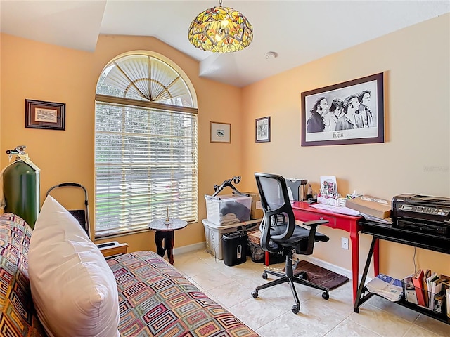 office with tile patterned flooring, lofted ceiling, baseboards, and a wealth of natural light