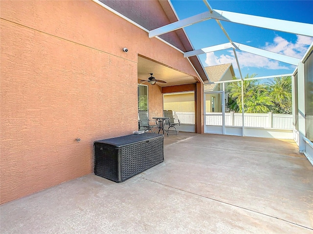 view of patio / terrace featuring a lanai and ceiling fan