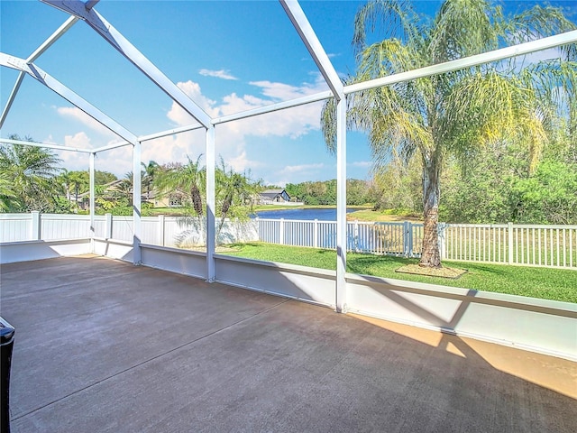 unfurnished sunroom with a water view