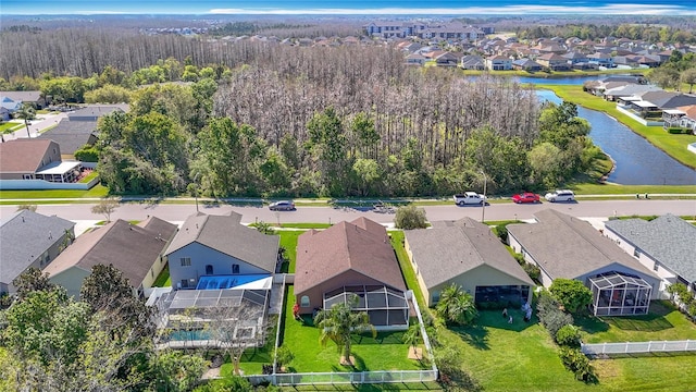 birds eye view of property with a residential view and a water view