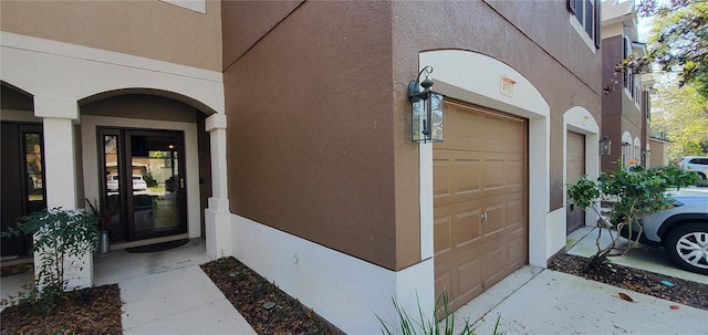 property entrance featuring stucco siding