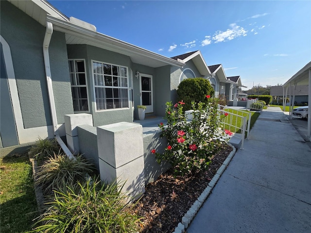 view of home's exterior featuring a residential view and stucco siding