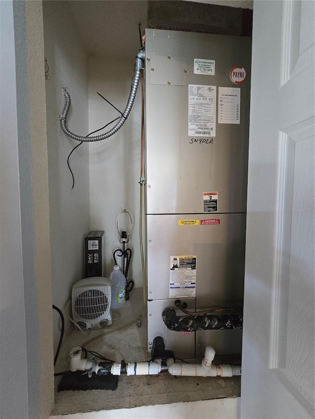 utility room with heating unit