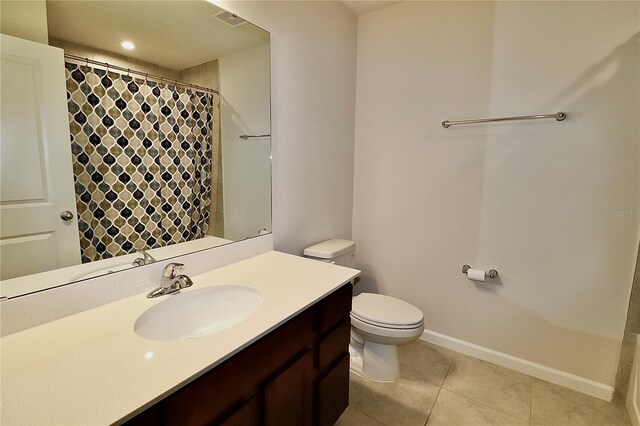 full bathroom featuring tile patterned floors, visible vents, toilet, baseboards, and vanity