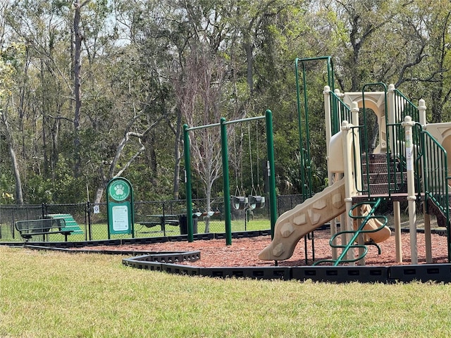 communal playground featuring a yard