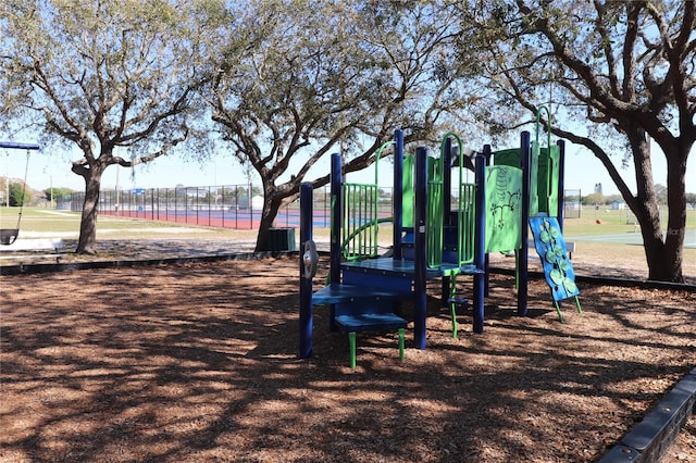 communal playground featuring fence