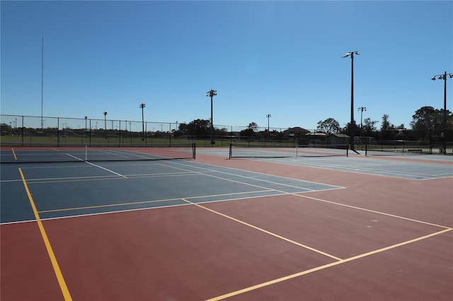 view of sport court with community basketball court and fence