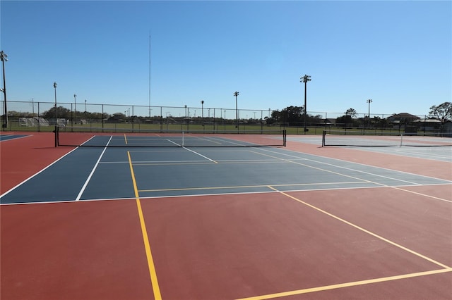 view of sport court with community basketball court and fence