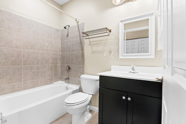 full bath with tile patterned floors, toilet, vanity, and bathing tub / shower combination