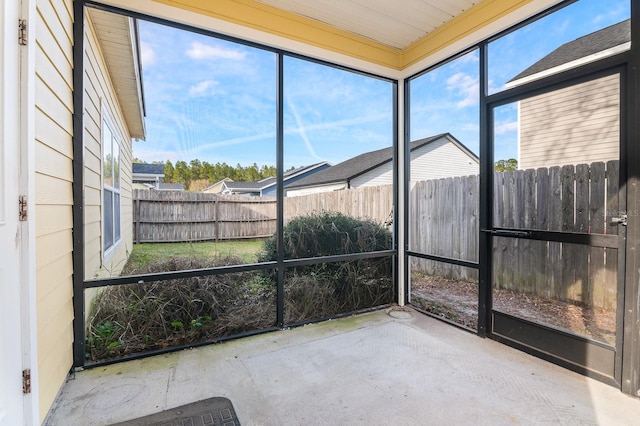 unfurnished sunroom with a wealth of natural light