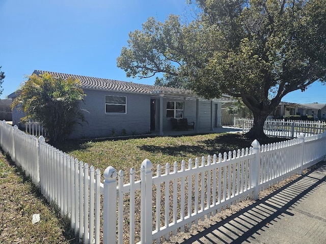 ranch-style home featuring a fenced backyard