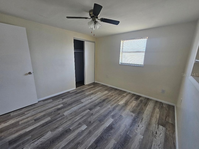 unfurnished bedroom featuring a closet, ceiling fan, baseboards, and wood finished floors