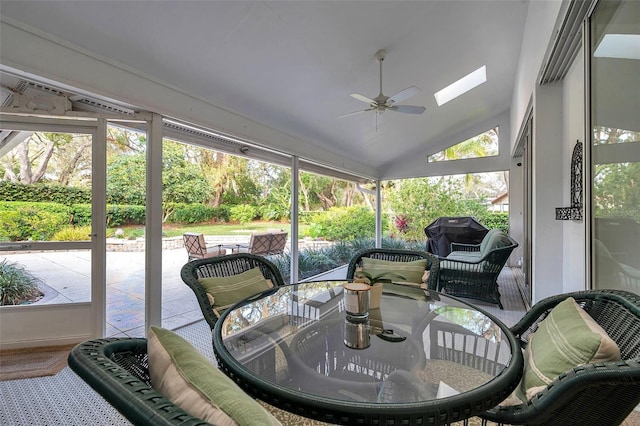 sunroom / solarium with ceiling fan and vaulted ceiling