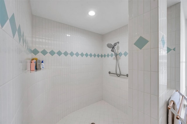 full bath featuring a tile shower