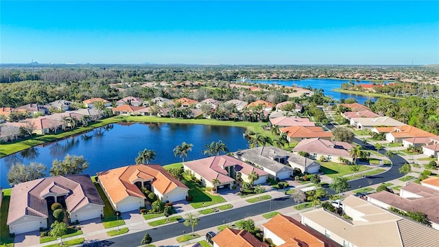 aerial view featuring a residential view and a water view