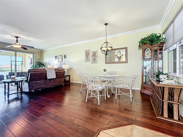 dining area featuring ornamental molding, baseboards, and wood-type flooring