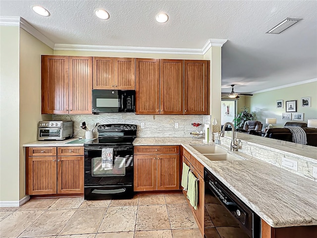 kitchen with black appliances, a sink, a peninsula, crown molding, and decorative backsplash