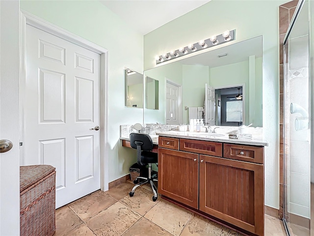 bathroom featuring vanity and a shower stall