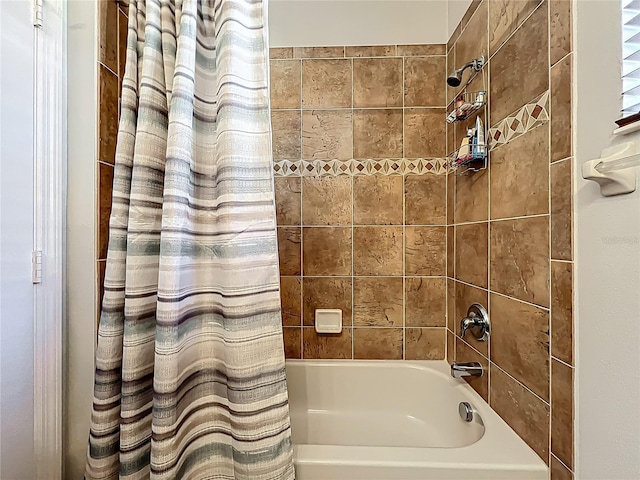 bathroom with shower / bathtub combination with curtain