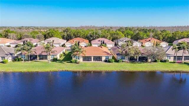 bird's eye view with a residential view and a water view