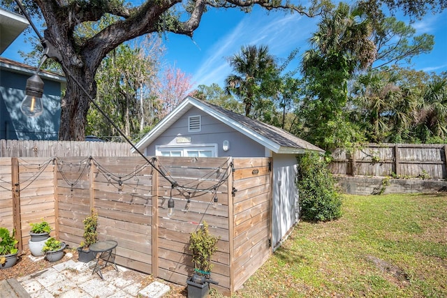 view of outbuilding with an outdoor structure and a fenced backyard