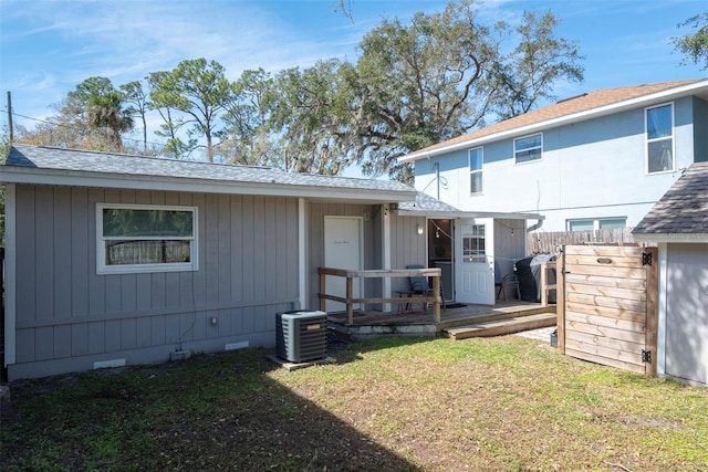 back of house with fence, cooling unit, a yard, a wooden deck, and crawl space