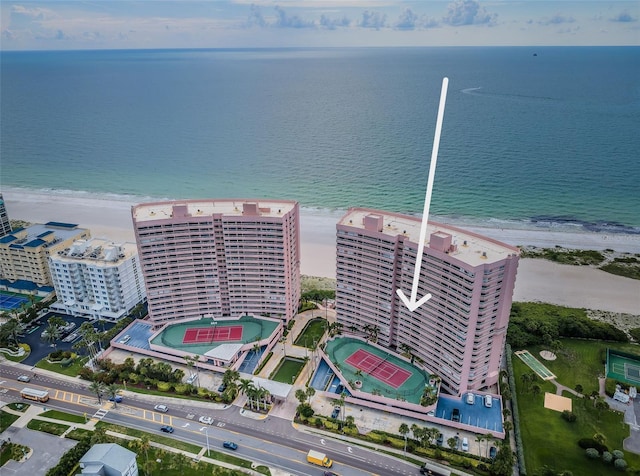 birds eye view of property with a view of the beach, a view of city, and a water view