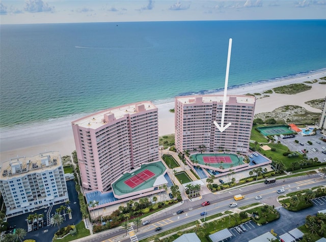 aerial view with a water view and a view of the beach