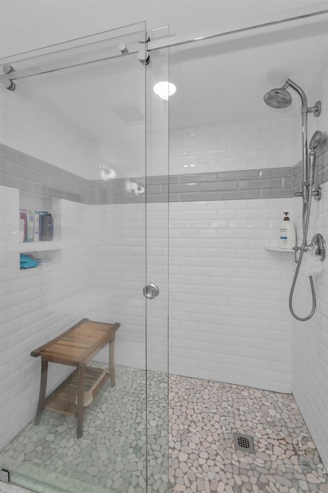 full bathroom featuring a shower stall