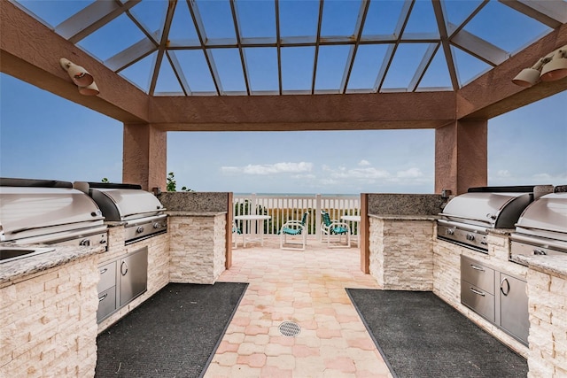 view of patio featuring an outdoor kitchen and area for grilling