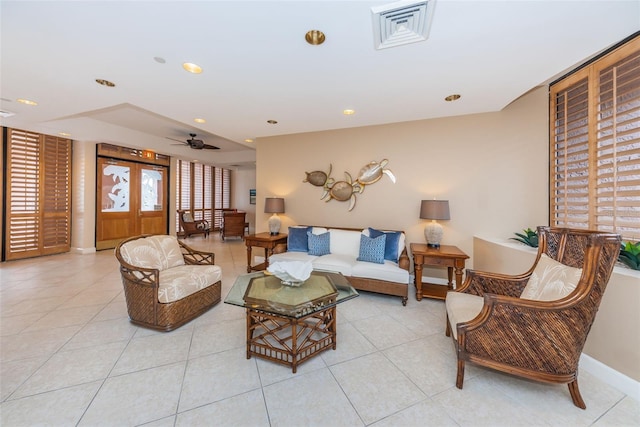 living room featuring light tile patterned floors, visible vents, baseboards, ceiling fan, and recessed lighting