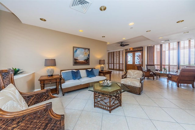 living room featuring light tile patterned floors, visible vents, and recessed lighting