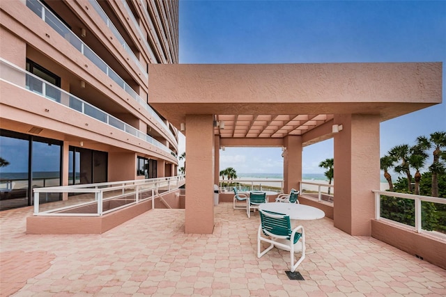 view of patio featuring outdoor dining space and a pergola