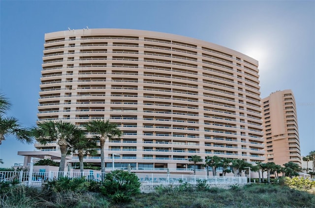 view of building exterior with fence