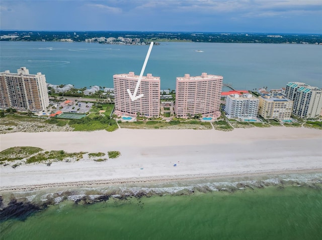 drone / aerial view featuring a view of city and a water view