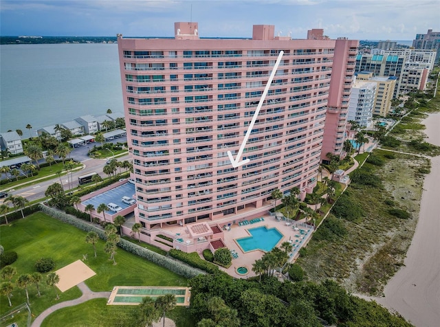 drone / aerial view featuring a water view and a city view