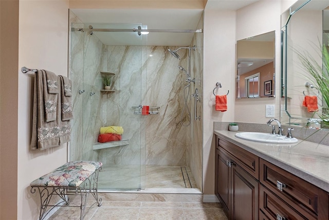 bathroom featuring vanity and a marble finish shower