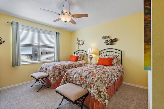 bedroom featuring carpet flooring, a ceiling fan, and baseboards